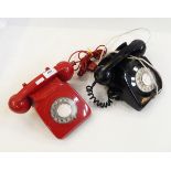 Vintage red plastic telephone and another black example,