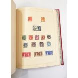 Two red stamp albums and contents of Worldwide mint and used stamps, mainly 1900 to 1950's,