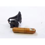 Metal miniature horn gramophone-pattern pencil sharpener and a brass cylindrical spirit level in