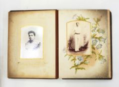 Victorian embossed leather photograph album and contents of portrait photographs of both children
