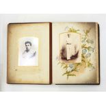 Victorian embossed leather photograph album and contents of portrait photographs of both children