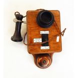 Wall-mounted Ericsson Railway telephone in oak case, with Seimens fittings,