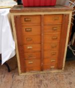 Collector's chest of two rows of seven short drawers