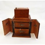 Smoker's compendium with two drawers, within wooden case,