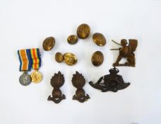 Three Royal Artillery cap badges, assorted Royal Artillery buttons, a Sphinx cap badge,
