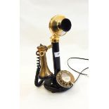 Candlestick telephone with brass mouthpiece