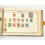 Vintage Lincoln album containing approximately 250 pages of mixed world stamps (some remaindering,