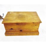 Small pine blanket box raised on a plinth base,