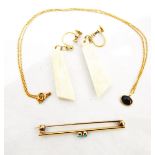 Gold-coloured metal and turquoise bar brooch set two small turquoise,