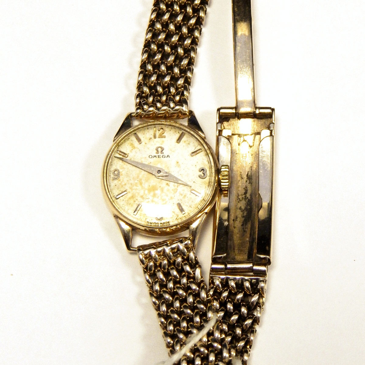 Lady's Omega 9ct gold dress watch with silvered dial and link chain expanding bracelet