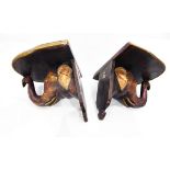 Pair of wall shelves in the form of carved wooden elephant heads,