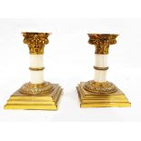 Pair of early 20th century ormolu and ivory Corinthian column candlesticks on square stepped bases