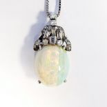 Opal and diamond set pendant with single oval cabochon opal suspended from Art Deco style setting,