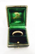 Two gold wedding rings of ropetwist design, unmarked, bought as 18ct gold from Elizabeth Gage,