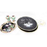 Pair of Minton porcelain black ground chargers decorated with swans,
