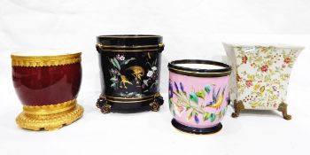 Black ground circular jardiniere with raised enamel floral decoration and gilt cranes,