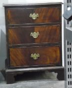 19th century three-drawer pedestal chest on bracket feet with brass bale handles and pierced plates,