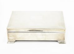 Silver cigarette box, Birmingham 1956, of engine turned rectangular form, on stepped feet,
