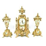 French clock garniture set in gilt metal cases, with painted enamelled dials and plaques,