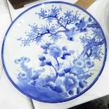 Japanese porcelain charger with underglaze blue decoration of birds flying among flowering branches,