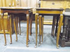 Two walnut nests of tables