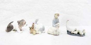 Four Lladro models, one of kneeling boy with a sheep, another of a rabbit,