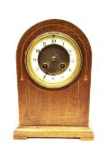 Edwardian mahogany dome-cased mantel clock, with enamelled chapter ring and striking movement,
