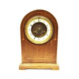 Edwardian mahogany dome-cased mantel clock, with enamelled chapter ring and striking movement,