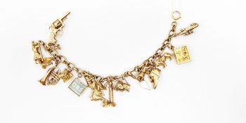 9ct gold belcher link charm bracelet hung with 16 9ct gold charms, including a lighthouse,