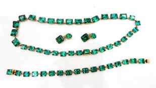 Green paste riviere necklace, the rectangular step cut paste in rolled gold closed back mounts,