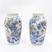 Pair of late 19th/early 20th century Japanese vases of baluster form decorated in blue and white