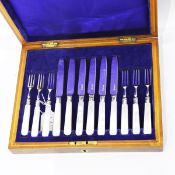 Set of six pairs of fruit eaters with mother-of-pearl handles and silver blades,