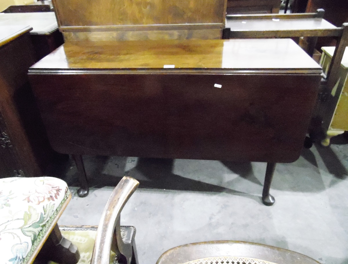 18th century mahogany drop-flap dining table, on turned legs with pad feet,