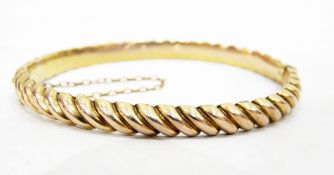 Gold-coloured metal hinged bangle,