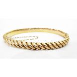 Gold-coloured metal hinged bangle,