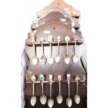 Large quantity of souvenir teaspoons on fitted racks (1 box)