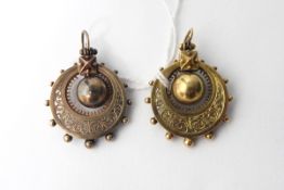 Pair of late Victorian gold-coloured pendant earrings of circular form with a central suspended