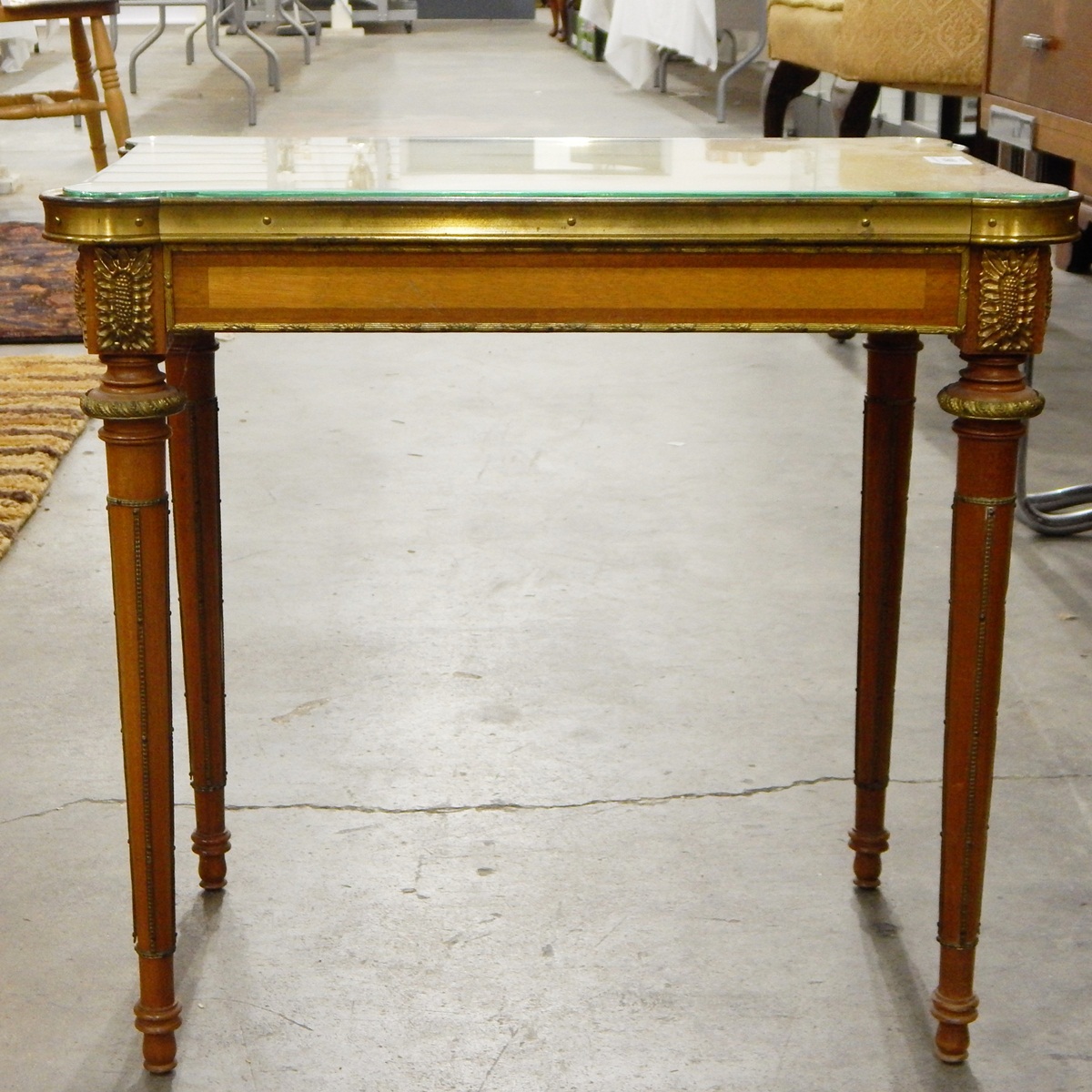 Pair of Louis XVI-style rectangular occasional tables with glass tops, on turned tapering legs,