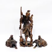 Japanese carved hardwood figure in traditional dress together with two hardwood carved water