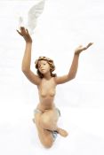 Lladro figure of kneeling girl holding dove 'Peace Offering',