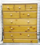 Modern pine chest of five short and three long drawers, on a plinth base,