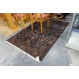 Handmade Afghan wool Belouch rug with deep blue ground, of floral and tree design,