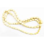 Turned graduated ivory bead necklace,