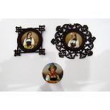 Three porcelain plaques depicting girls in traditional costumes,