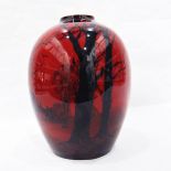 Royal Doulton flambé vase with typical red ground, silhouette of bear, trees, mistletoe and birds,