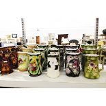 Six sets of various graduated jugs,