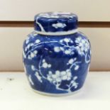 Pair of Chinese porcelain ginger jars and cover with typical prunus blossom decoration, 11cm high,