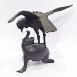 Japanese bronze model of an eagle preying on a monkey,