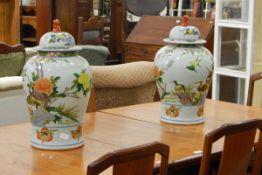 Pair of Chinese porcelain inverse-baluster vases and covers, each decorated with cranes,