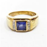 9K blue stone and diamond ring set square cut central blue stone flanked by small diamonds set